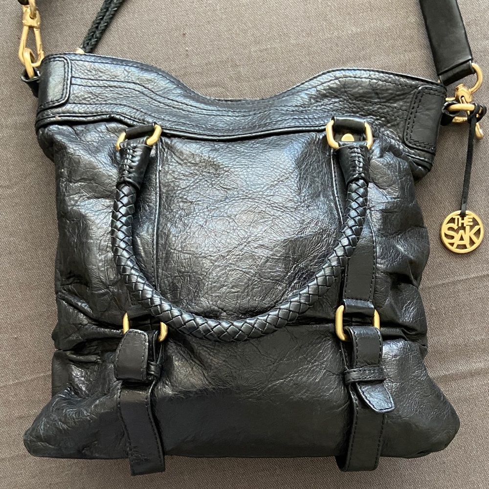 The Sak Black Leather Shoulder Bag with Gold Accents